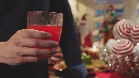 Two people toasting each other with glass of punch. Stock Footage 127068967