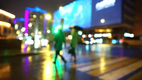 Two people with an umbrella cross the road. Stock Footage 103551968