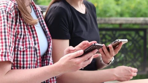 Two people using smartphone. Close-up of hands with mobile phone Video stock 337624450