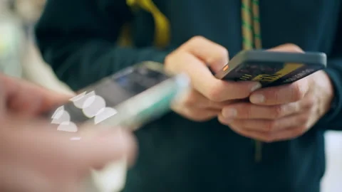 Two People Using Smartphones Close Up Hands Texting and Browsing Mobile Devices. Stock Footage 341988308