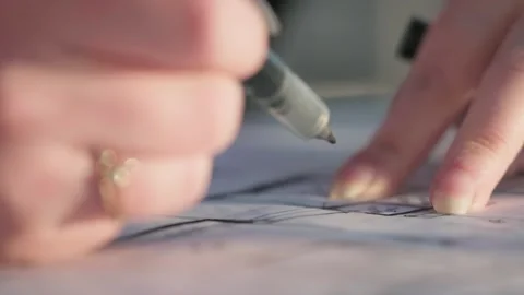 Two people viewing plans in evening light 스톡 동영상 288992335