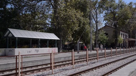 Two people waiting to walk through a train station Stock Footage 91900519
