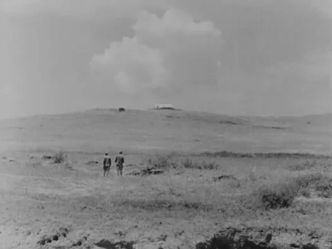 Two people walk through desert Stock Footage 158024453