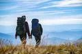 The two people walking on the mountain Photo