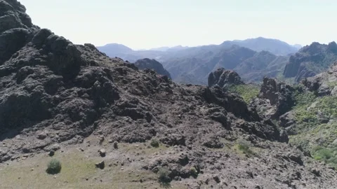 Two people walking at rocks formations at Gran Canarias in the Canary Island Stock Footage 132718076