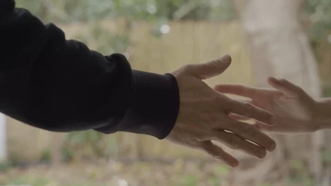 Two people want to shake hands but result to elbow shake Stock Footage