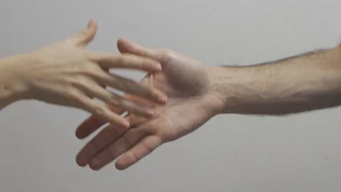 Two people want to shake hands but do elbow shake instead Video stock 127282969