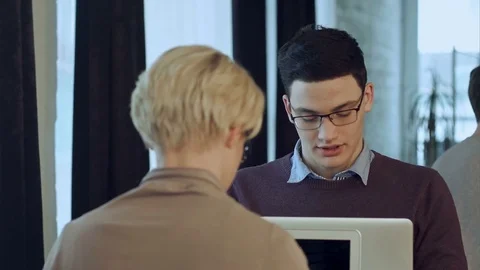 Two people working in cafe, using laptop and drinking cofe Video stock 78721152