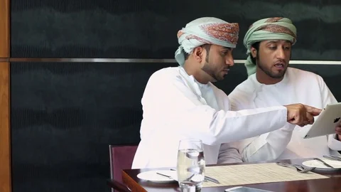 Two people working on a digital tablet in a restaurant Stock Footage 70102819