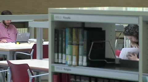 Two people working at a library Stock Footage 20996145