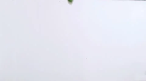 Two peppers in super slow motion falling in the water Stock Footage