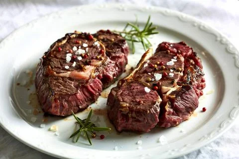 Two perfectly seared beef steaks Stock Photos