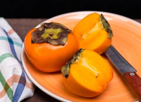 Two persimmons Stock Photos
