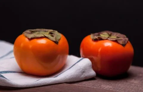 Two persimmons Stock Photos
