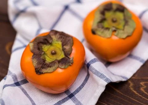Two persimmons Stock Photos