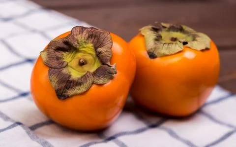 Two persimmons Stock Photos