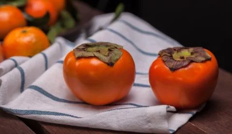 Two persimmons Stock Photos