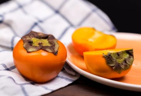 Two persimmons Stock Photos