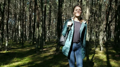 Two person: guy with girlfriend spending time in the autumn woodland. Hike style Stock Footage 199492952
