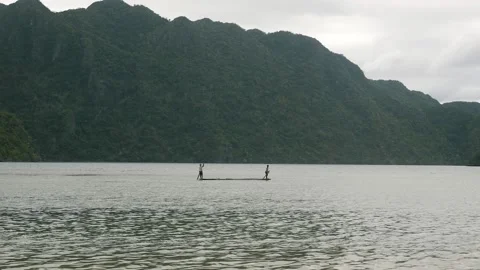 Two persons on paddle board in Philippines Stock-Footage 131782886