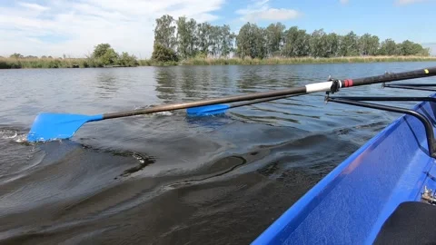 Two Persons Rowing On A River Stock Footage 205187757