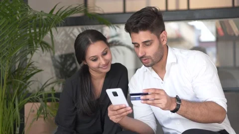 Two persons/friends purchasing online using credit card. Stock-Footage 146301159