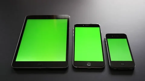 Two phones and a tablet with a chroma key screen. Stock Footage 55492973