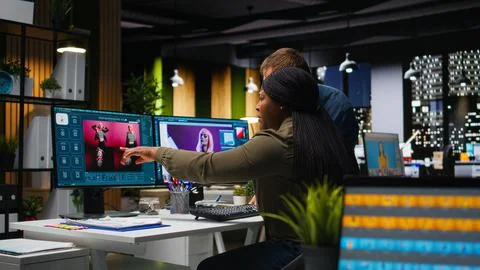 Two photo editors using AI tools and program for retouching Stock Photos