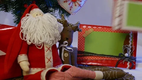 Two Photo Frames and a Hand Made Owl Are Placed Under a Christmas Fir Tree, Stock Footage 72548601