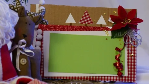 Two Photo Frames Are Taken Away From a Christmas Fir Tree, Under Which There Stock Footage 72878595