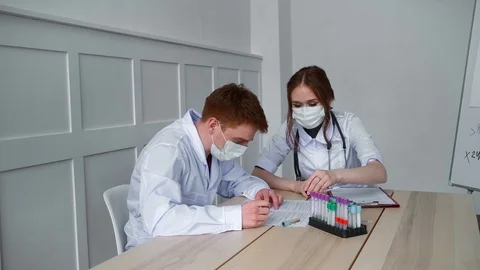 Two physician-laboratory study of the blood for the presence of coronavirus Stock Footage 126750906