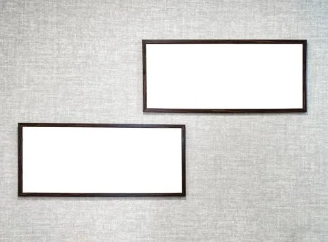 Two picture frames with copy space for text hanging on the wall with wallpape Stockfoto's