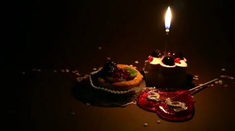 Two pie and candle in the dark Stock Footage 10897436