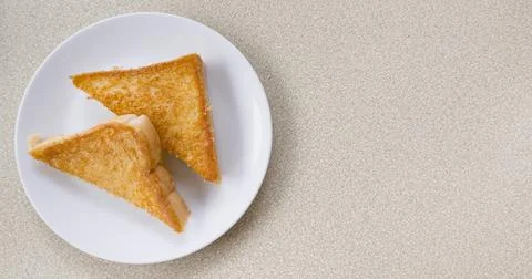 Two piece triangle slices of toasted bread made from white wheat flour and a Stock Photos