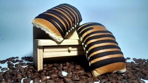 Two pieces of bread on a miniature table Stock Photos