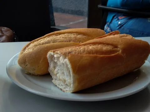 Two pieces of bread on a plate Stock Photos