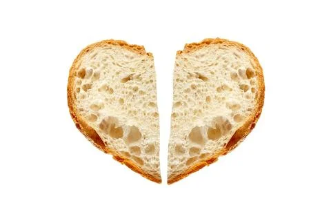 Two pieces of Bread in shape of broken heart isolated on white background Stock Photos