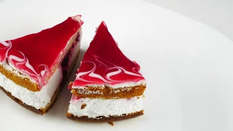 Two pieces of cake on a white plate. Stock Footage 128698024
