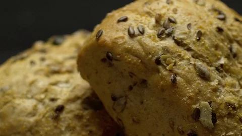 Two pieces of integral bread on a wooden board Stock Footage 117343523