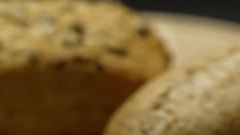 Two pieces of integral bread on a wooden board Stock Footage 117343605