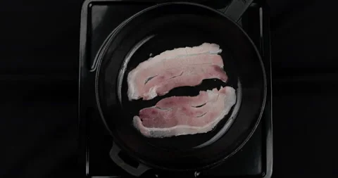 Two pieces of meat at frying pan at home kitchen 스톡 동영상 140688967