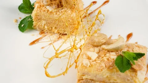 Two Pieces of multi layered dessert cake or Napoleon Stock Footage 90658733