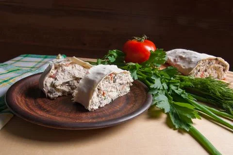 Two pieces of pita bread or lavash roll with cottage cheese or curd, chicken, Stock Photos