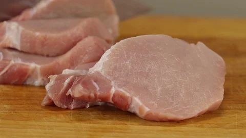 Two pieces of raw pork Stock Footage 122119007