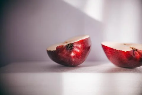 Two pieces of red apple on a white background Stock Photos