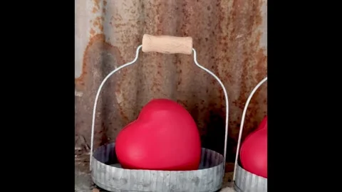 Two pieces of small red heart shape put in basket,sign and symbol of love a.. Video stock 327271217
