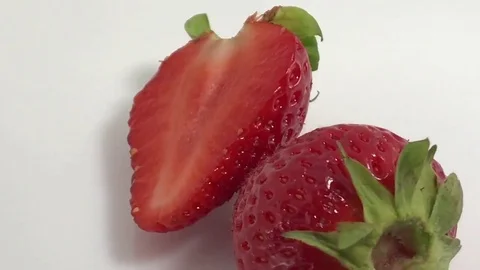 Two Pieces of Strawberry Red berry fruit, sweet ripe, healthy. Fresh, ripe Stock Footage 80805272