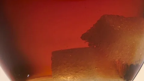 Two pieces of sugar on the bottom of cup tea Stock Footage 73851637