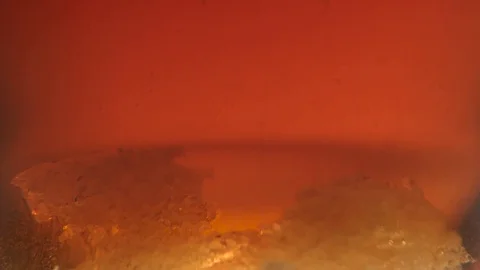 Two pieces of sugar melt at the bottom, close ups Stock Footage 73766633