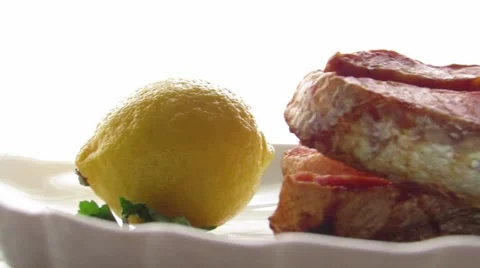Two pieces of truot on plate Stock Footage 60128438